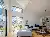 Modernes Wohnzimmer mit offenem Wohnbereich - LUXHAUS Bungalow Pultdach 150